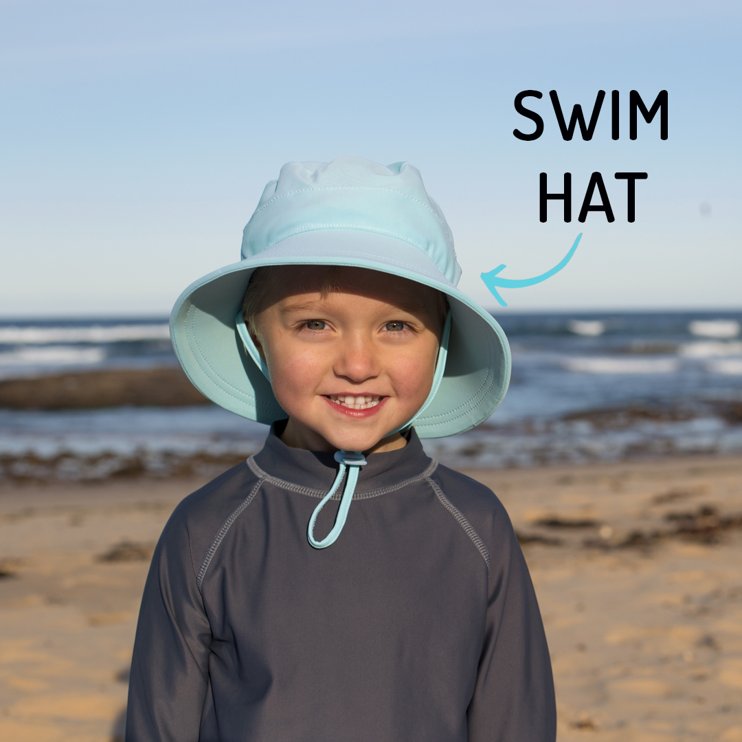 Boy wearing Bedhead swim hat - aqua