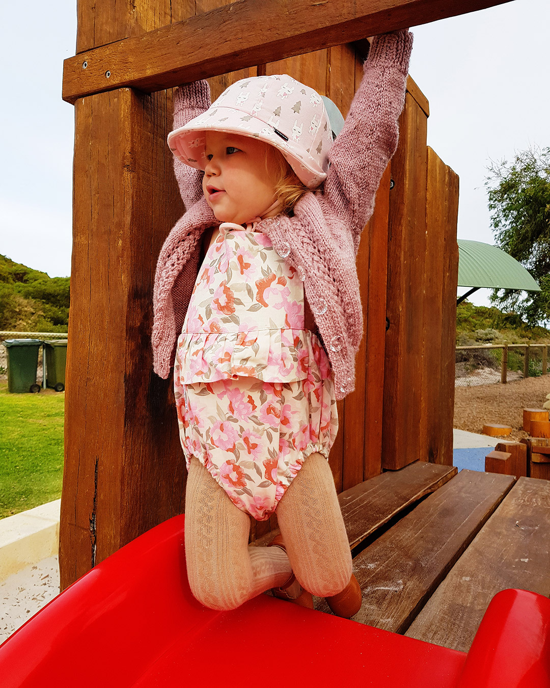 Toddler swinging wearing Bedhead Baby Bucket Hat 'Bunny' Print