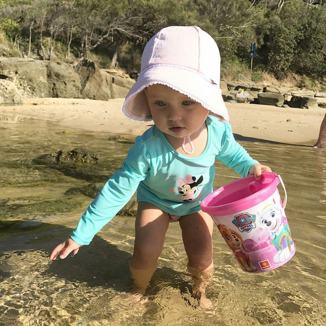 Toddler girl wearing Bedhead Baby Bucket pink ruffle